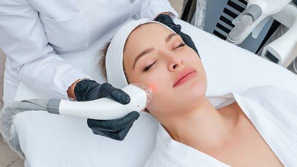 Dermatologist examining patient's skin