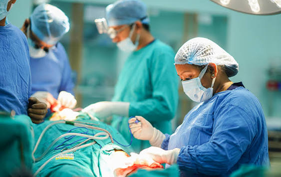 Surgical team operating